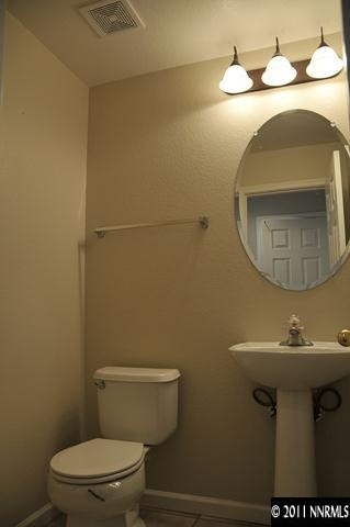 3871 Warren Way Reno, NV 89509 - Photo 6 of 13 a bathroom with a sink and a mirror