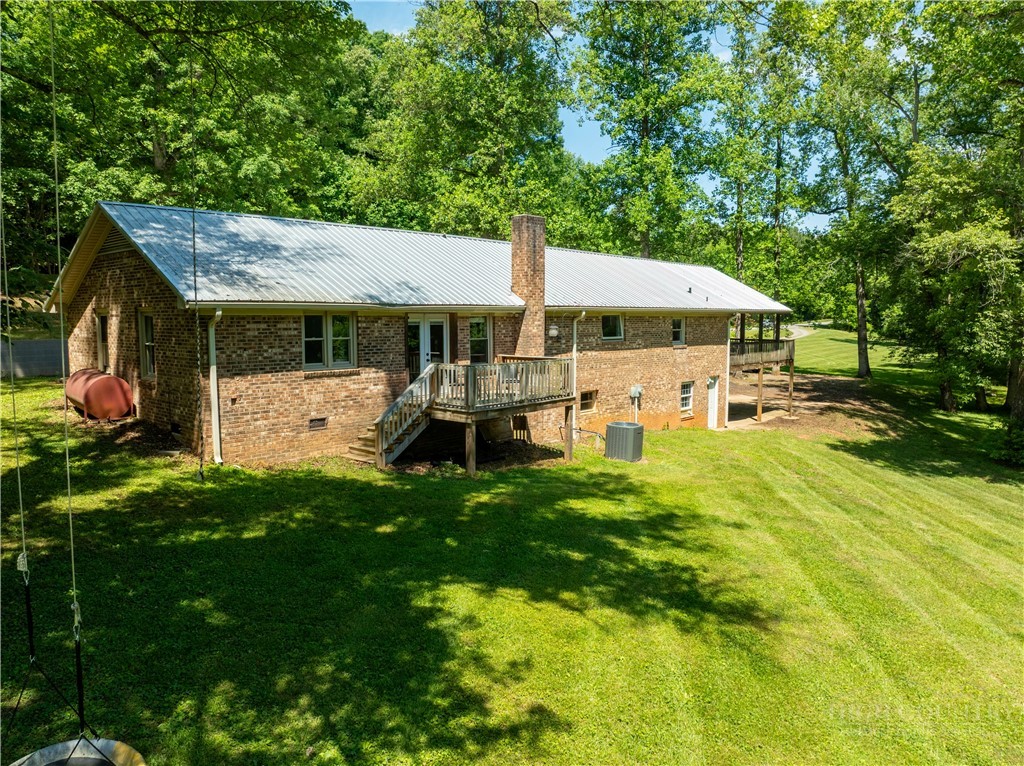 142 Pioneer Road Harmony, NC 28634 - Photo 8 of 49 a front view of a house with garden