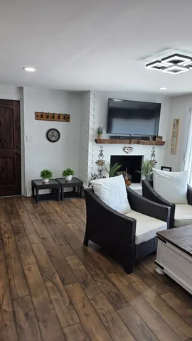 a living room with furniture and a fireplace