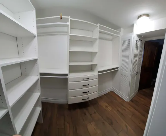 a storage room with wooden floor