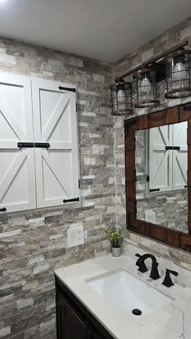 a bathroom with a sink and a mirror