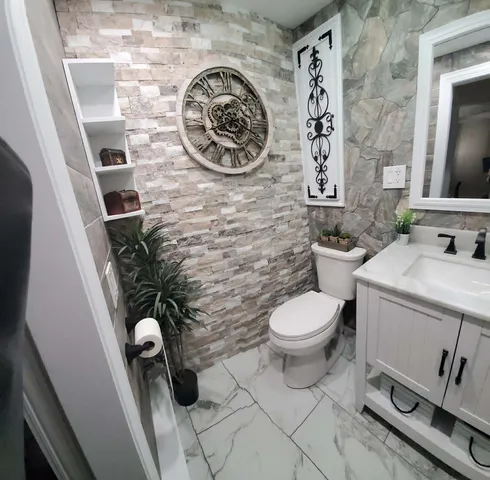 a bathroom with a toilet and a sink