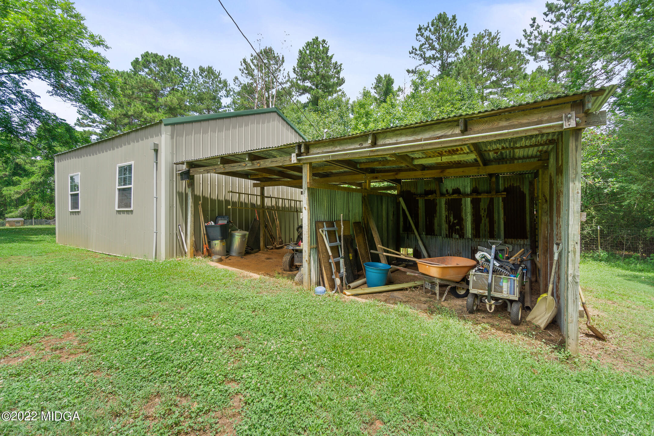 145 T W Leverette Road Jackson, GA 30233 - Photo 54 of 71 a view of a chair and table in backyard of the house