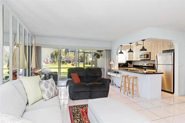 a living room with furniture and a rug