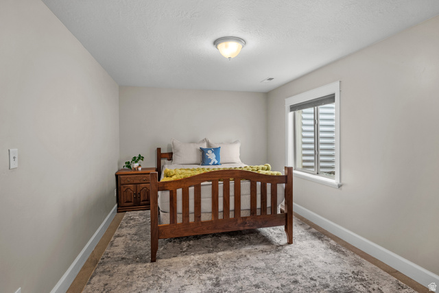 1896 West 800 North Mapleton, UT 84663 - Photo 31 of 55 Bedroom featuring baseboards and a textured ceiling