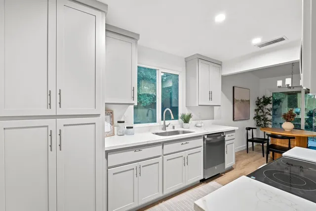 a kitchen with a sink and cabinets