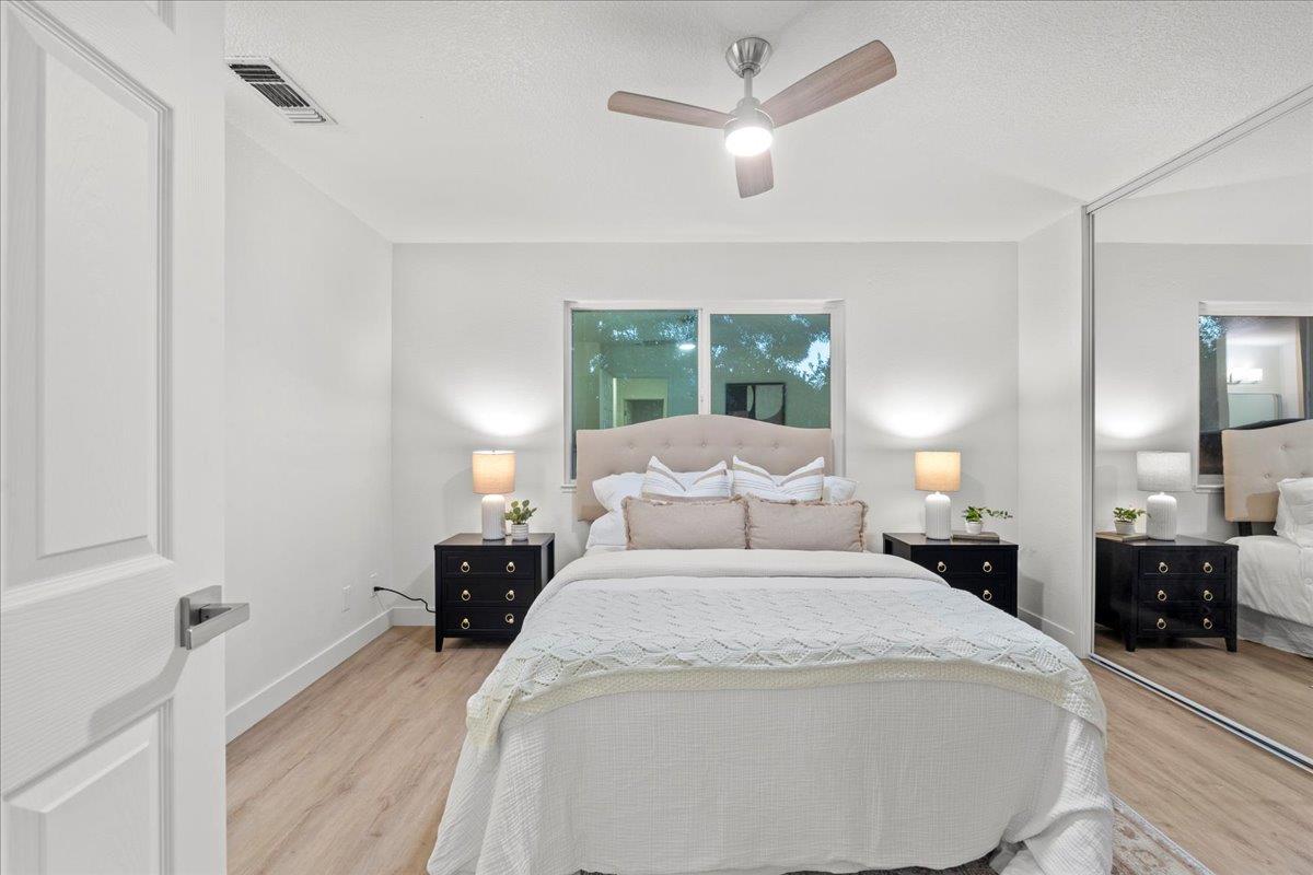 6637 Briartree Way Citrus Heights, CA 95621 - Photo 13 of 23 a bedroom with a bed and a large mirror