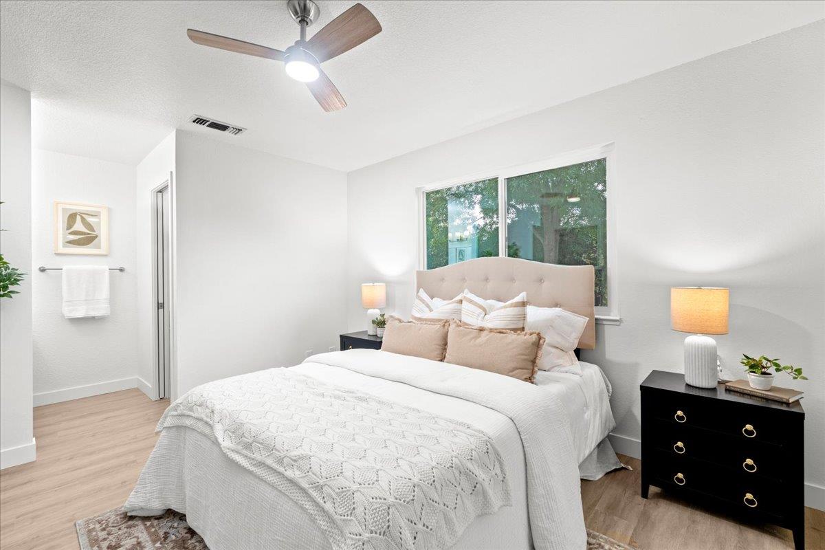 6637 Briartree Way Citrus Heights, CA 95621 - Photo 14 of 23 a bedroom with a bed and a lamp