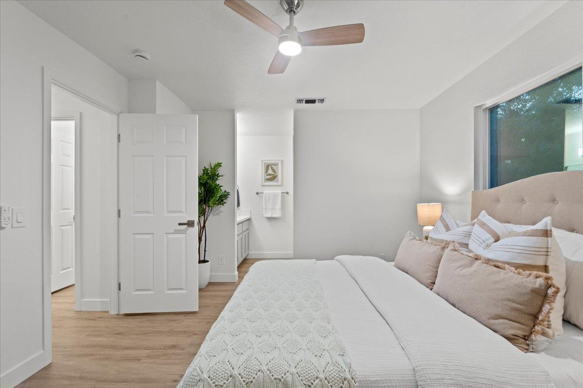 6637 Briartree Way Citrus Heights, CA 95621 - Photo 15 of 23 a bedroom with a bed and a chandelier