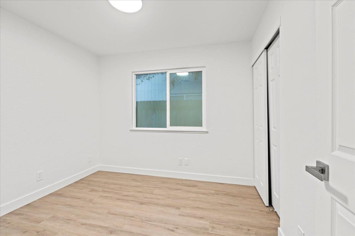 6637 Briartree Way Citrus Heights, CA 95621 - Photo 17 of 23 a view of an empty room with wooden floor and a window