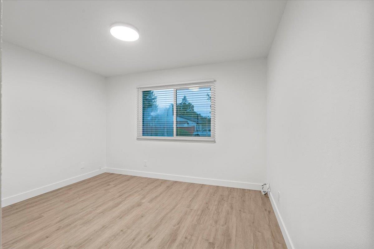 6637 Briartree Way Citrus Heights, CA 95621 - Photo 18 of 23 an empty room with wooden floor and windows