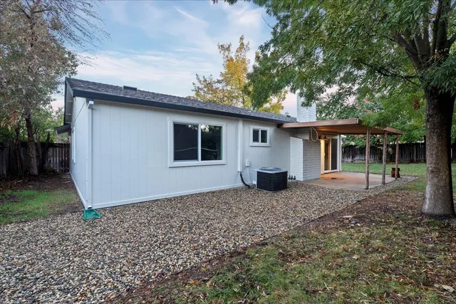 a house with trees in the background