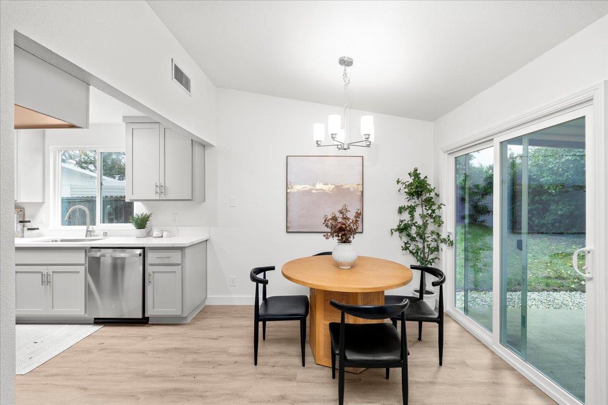 6637 Briartree Way Citrus Heights, CA 95621 - Photo 8 of 23 a view of a dining room and livingroom with furniture wooden floor a chandelier