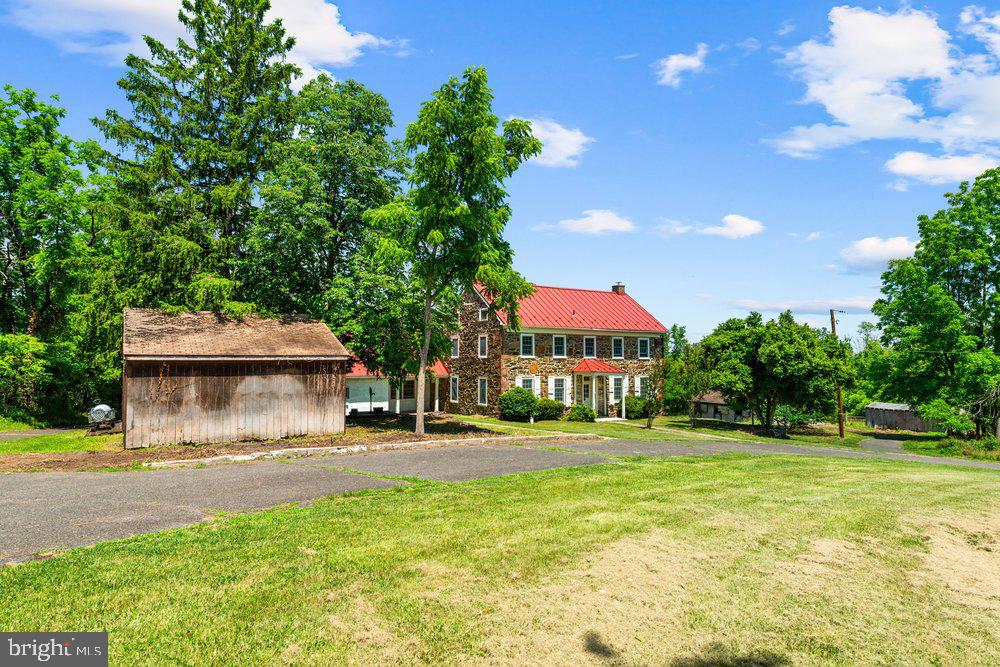 201 East Moyer Road Pottstown, PA 19464 - Photo 6 of 64 a front view of a house with a yard and trees