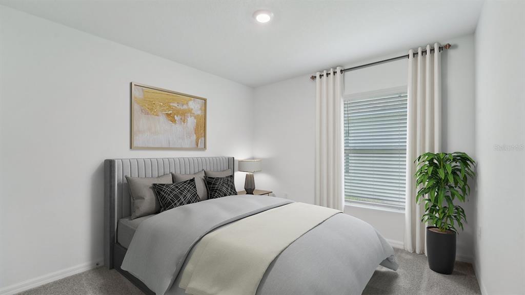 35381 Vly Rdg Road Dade City, FL 33525 - Photo 12 of 22 a bedroom with a bed and a potted plant