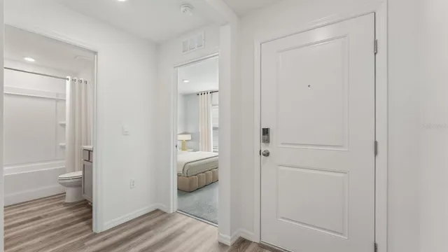 a bathroom view of a toilet and a shower