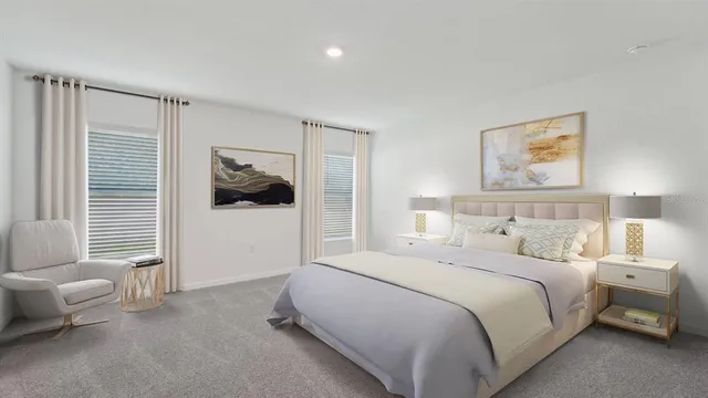 a bedroom with a bed and a couch