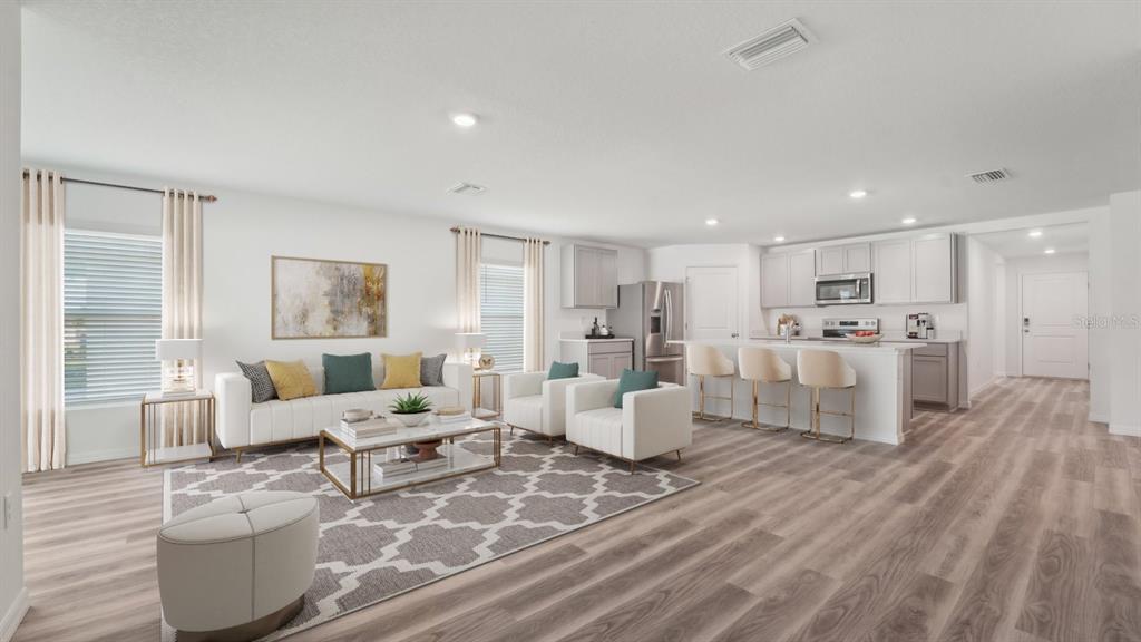 35381 Vly Rdg Road Dade City, FL 33525 - Photo 4 of 22 a living room with furniture and view of kitchen