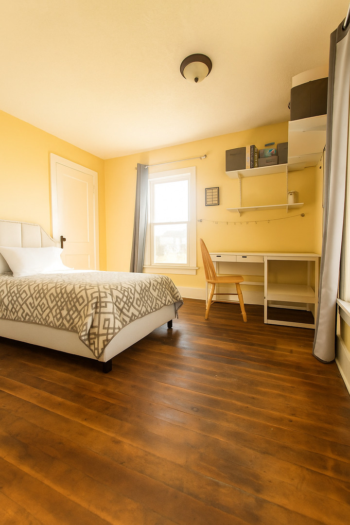 23396 Ideal Road Chadwick, IL 61014 - Photo 11 of 23 a bedroom with a bed and wooden floor