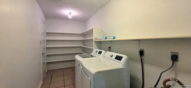 a utility room with washer and dryer