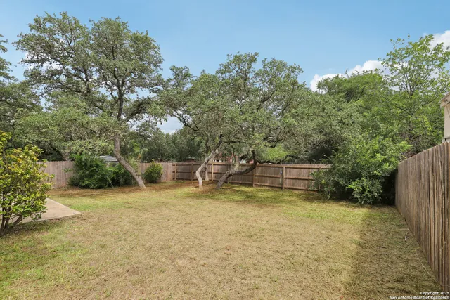 a view of a house with swimming pool and sitting area