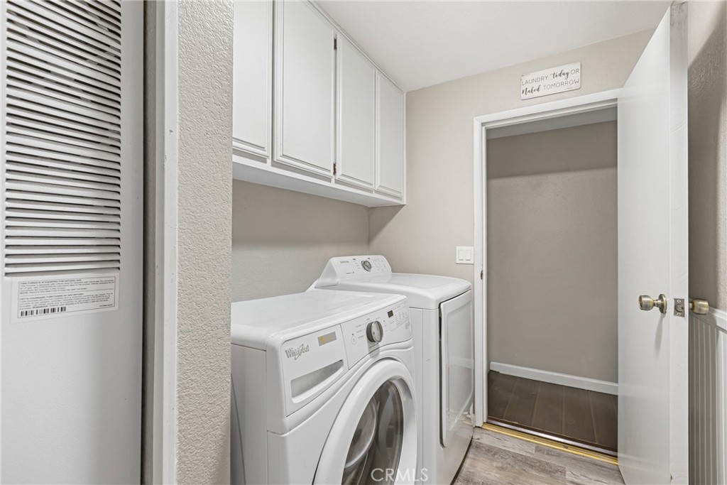 21650 Temescal Canyon Road, Unit 13 Corona, CA 92883 - Photo 15 of 21 a utility room with dryer and washer