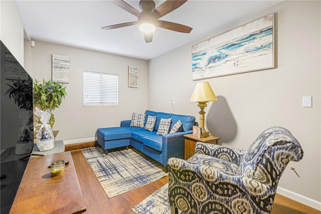 21650 Temescal Canyon Road, Unit 13 Corona, CA 92883 - Photo 16 of 21 a living room with furniture flowerpot and a window