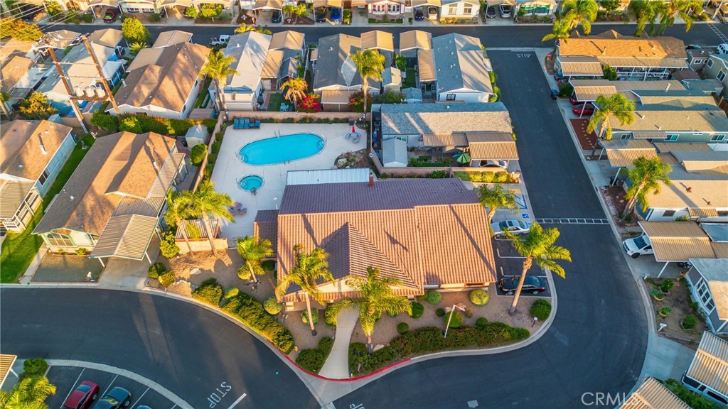 21650 Temescal Canyon Road, Unit 13 Corona, CA 92883 - Photo 19 of 21 an aerial view of residential houses with outdoor space