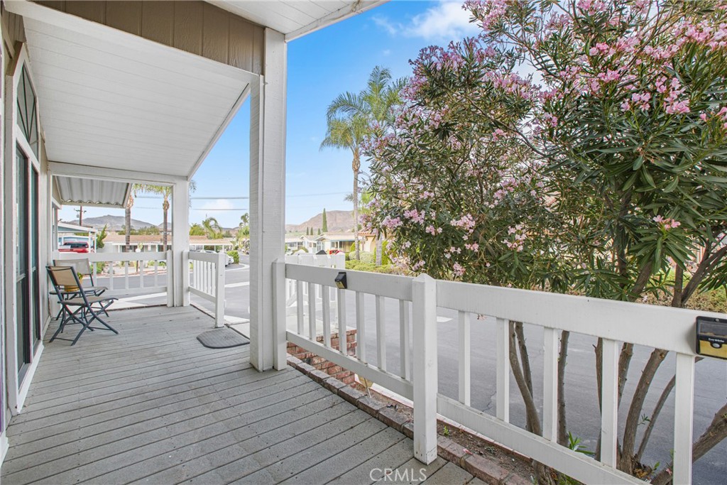 21650 Temescal Canyon Road, Unit 13 Corona, CA 92883 - Photo 3 of 21 a view of a balcony with chairs
