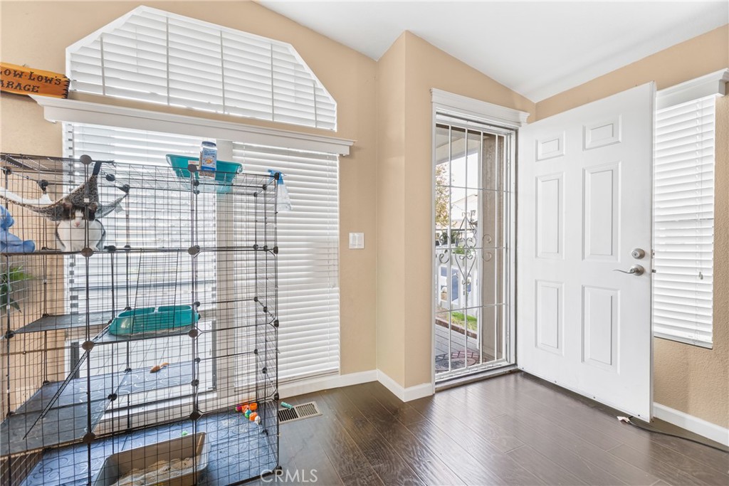 21650 Temescal Canyon Road, Unit 13 Corona, CA 92883 - Photo 4 of 21 a view of an entryway with wooden floor