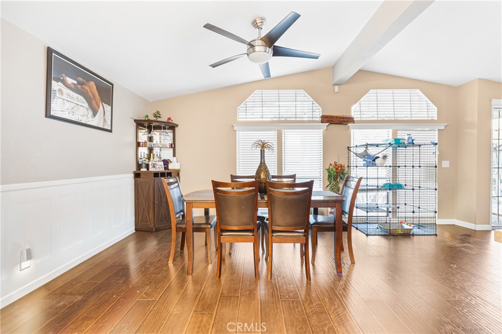 21650 Temescal Canyon Road, Unit 13 Corona, CA 92883 - Photo 5 of 21 a view of a dining room with furniture window and wooden floor