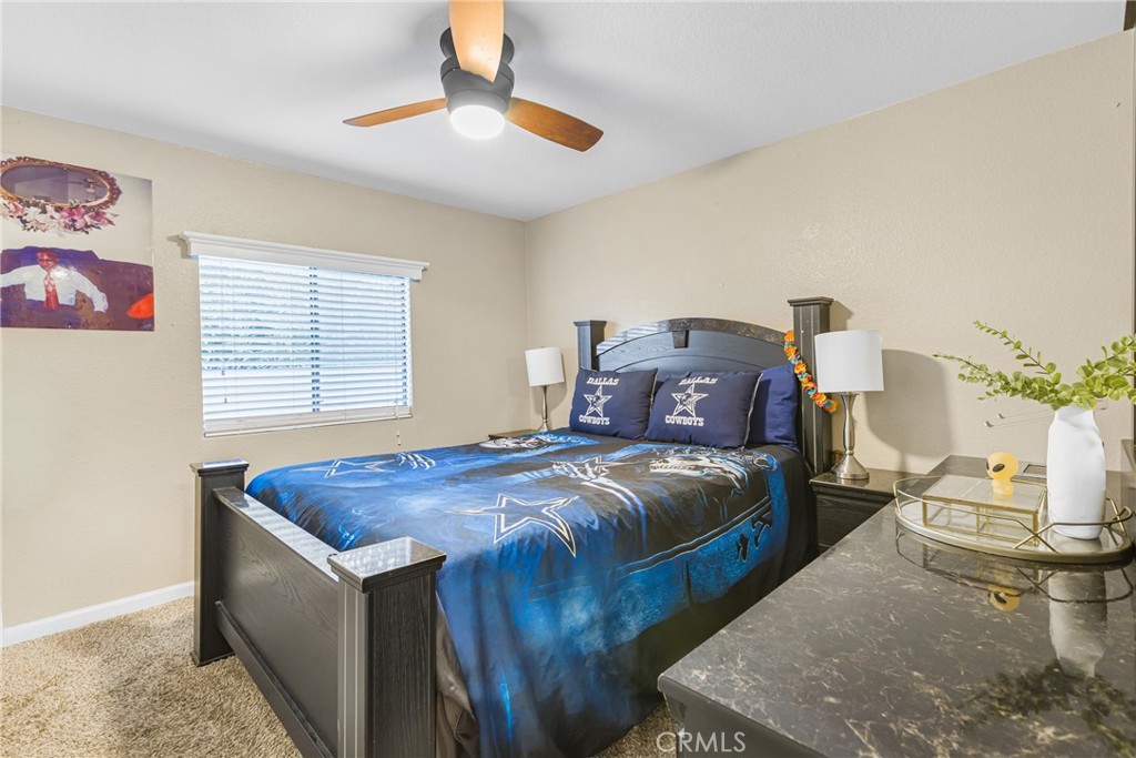 21650 Temescal Canyon Road, Unit 13 Corona, CA 92883 - Photo 9 of 21 a bedroom with bed and window