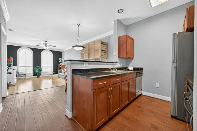 a room with wooden floor and staircase