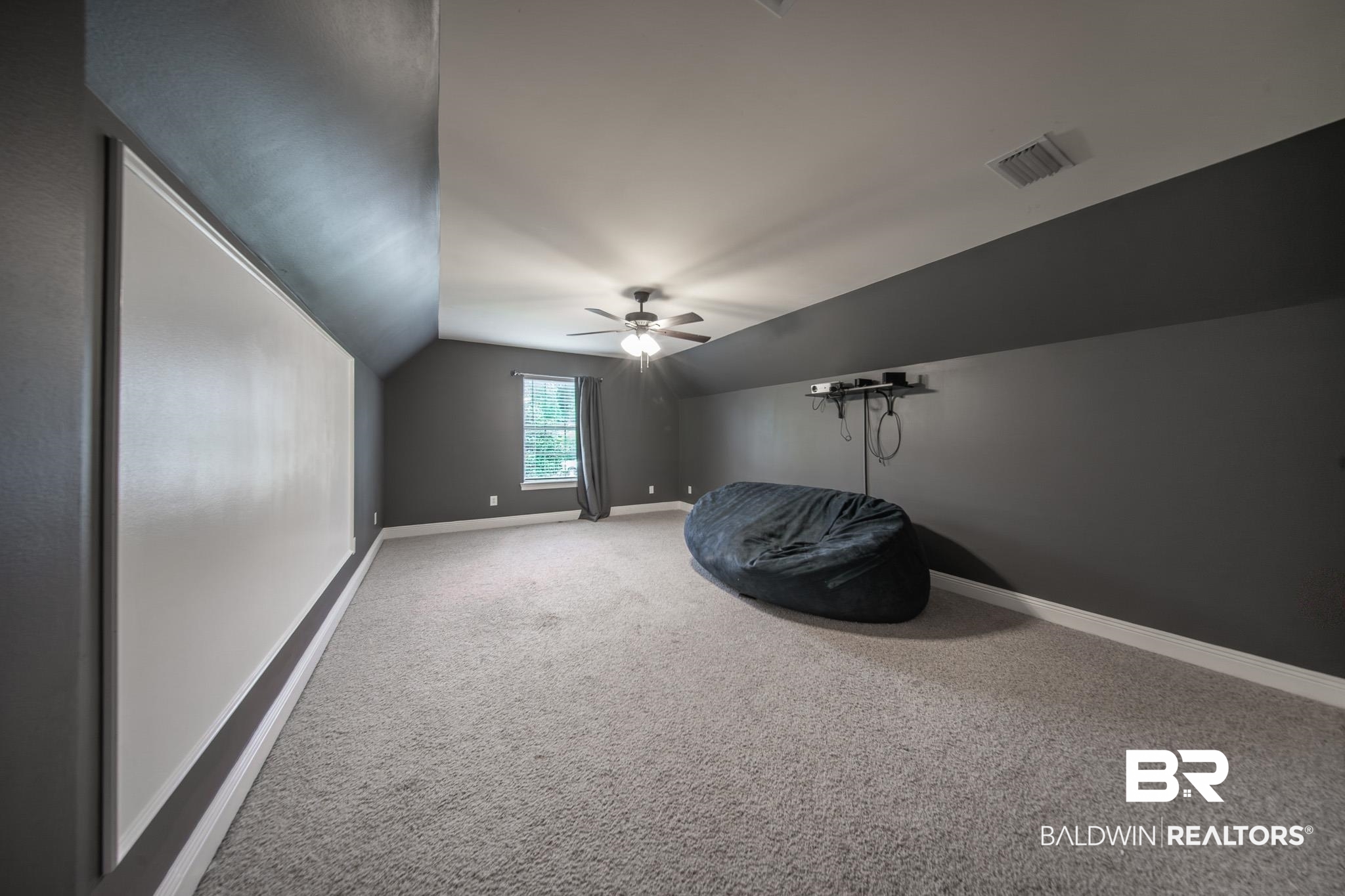 8421 Weatherford Court Daphne, AL 36527 - Photo 29 of 36 Additional living space with carpet floors, vaulted ceiling, and a ceiling fan