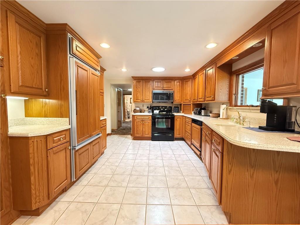 325 Williamson Road Greenville, PA 16125 - Photo 16 of 50 a large kitchen with stainless steel appliances lots of counter top space