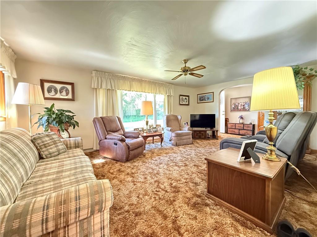 325 Williamson Road Greenville, PA 16125 - Photo 25 of 50 a living room with furniture fireplace and a flat screen tv