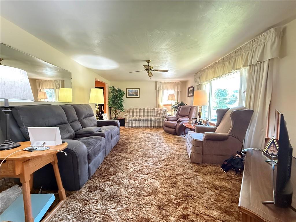 325 Williamson Road Greenville, PA 16125 - Photo 27 of 50 a living room with furniture a large window and a rug