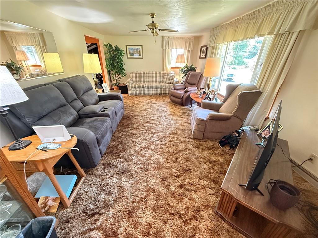 325 Williamson Road Greenville, PA 16125 - Photo 28 of 50 a living room with furniture a flat screen tv and a window