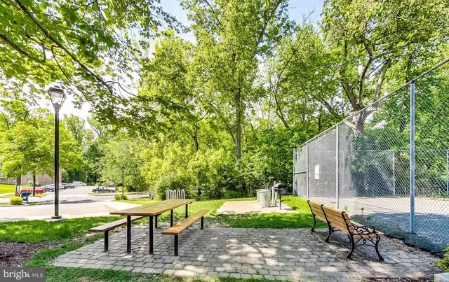 a swimming pool with outdoor seating and yard
