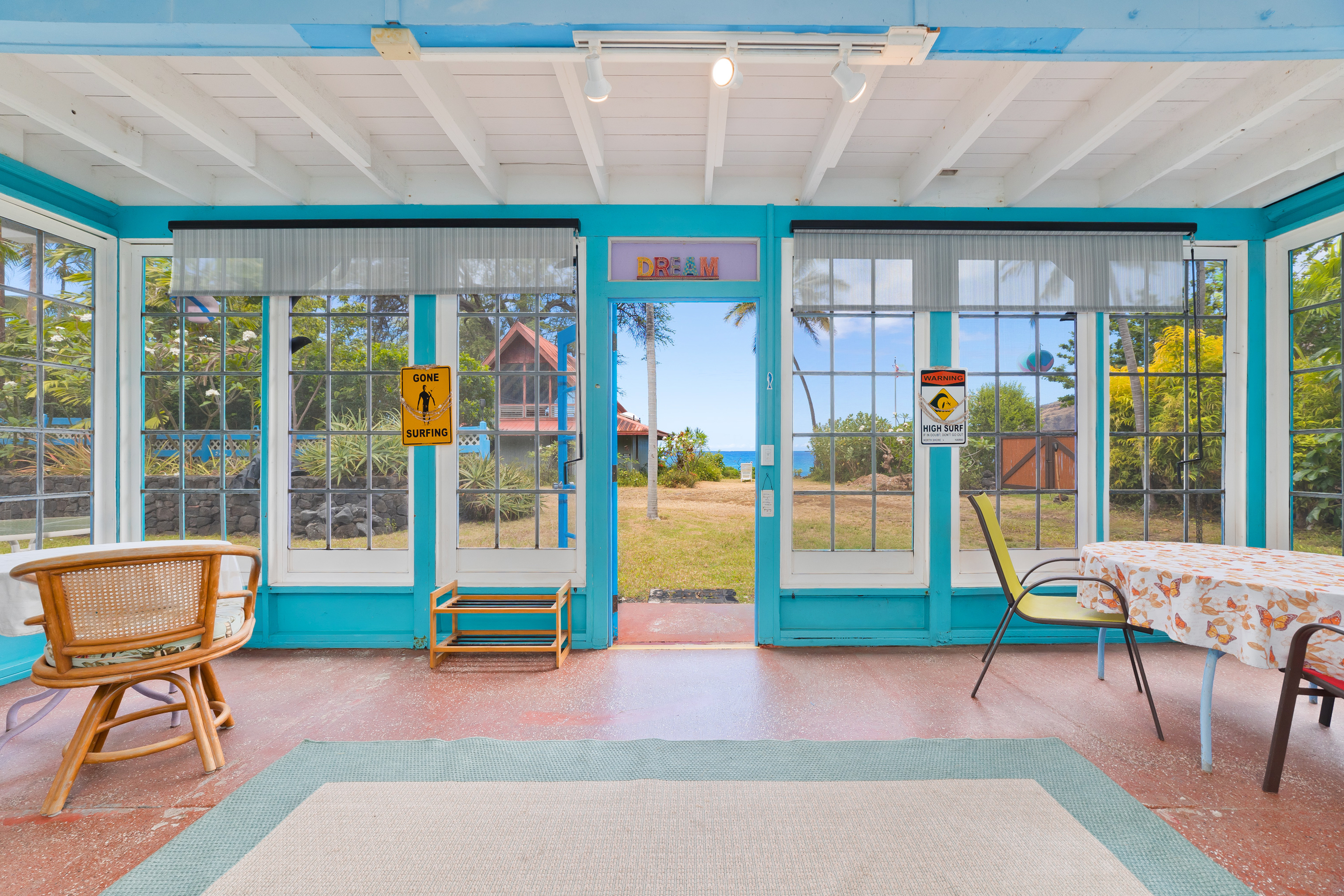 82-6301 Puuhonua Road Captain Cook, HI 96704 - Photo 17 of 27 a living room with furniture and a floor to ceiling window