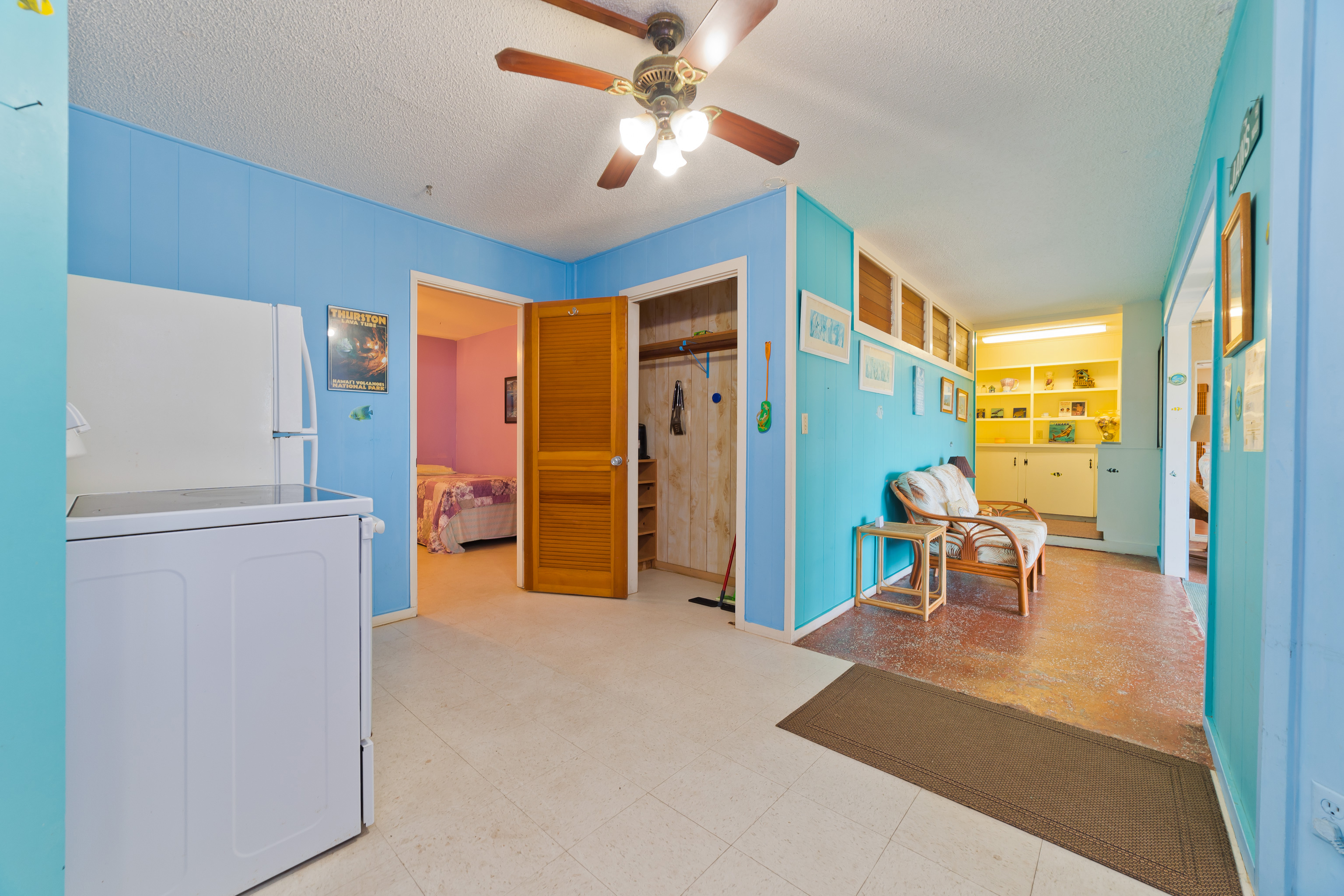 82-6301 Puuhonua Road Captain Cook, HI 96704 - Photo 22 of 27 a view of a livingroom with furniture and a refrigerator