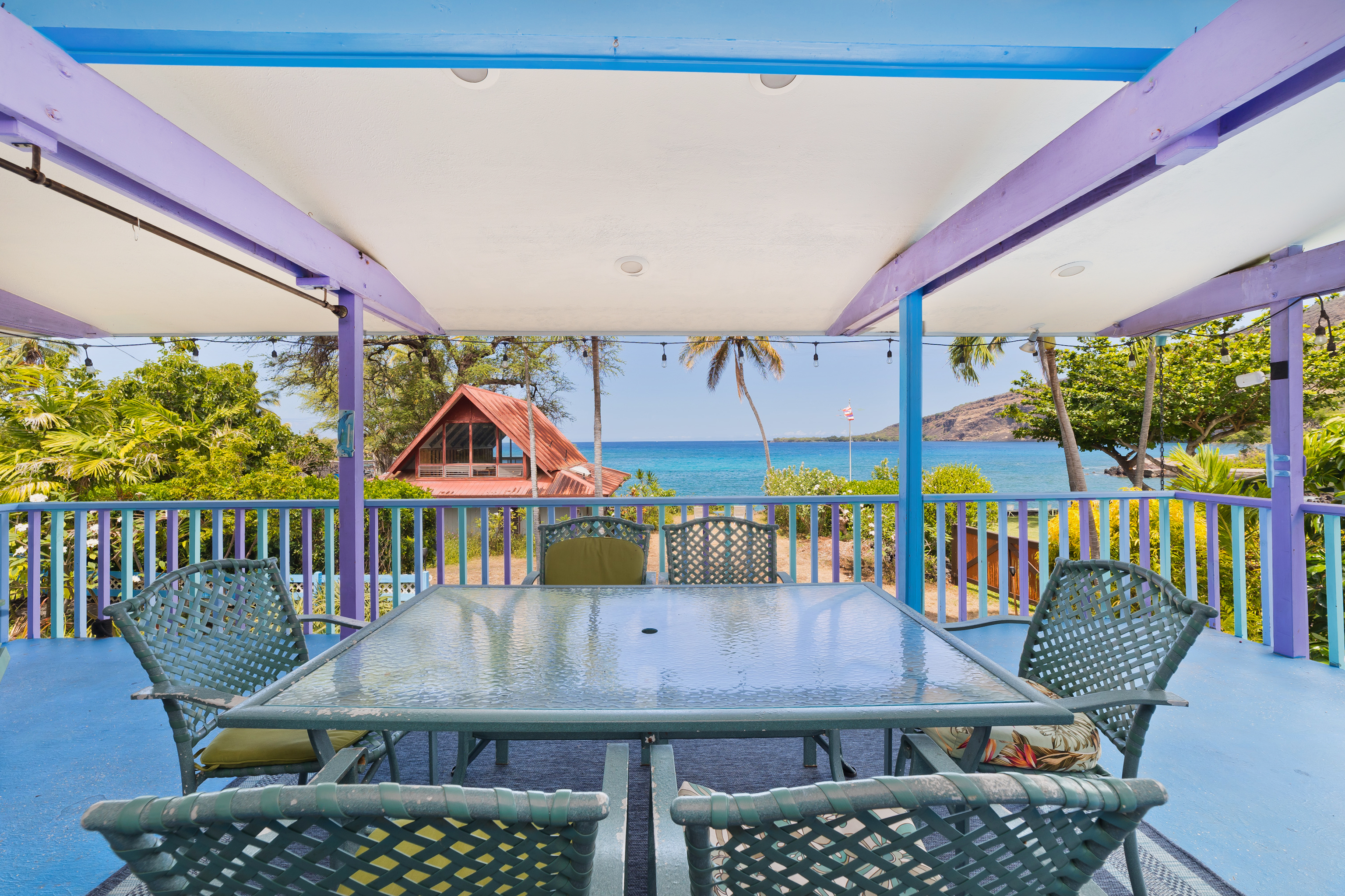 82-6301 Puuhonua Road Captain Cook, HI 96704 - Photo 3 of 27 a view of a patio with a table and chairs