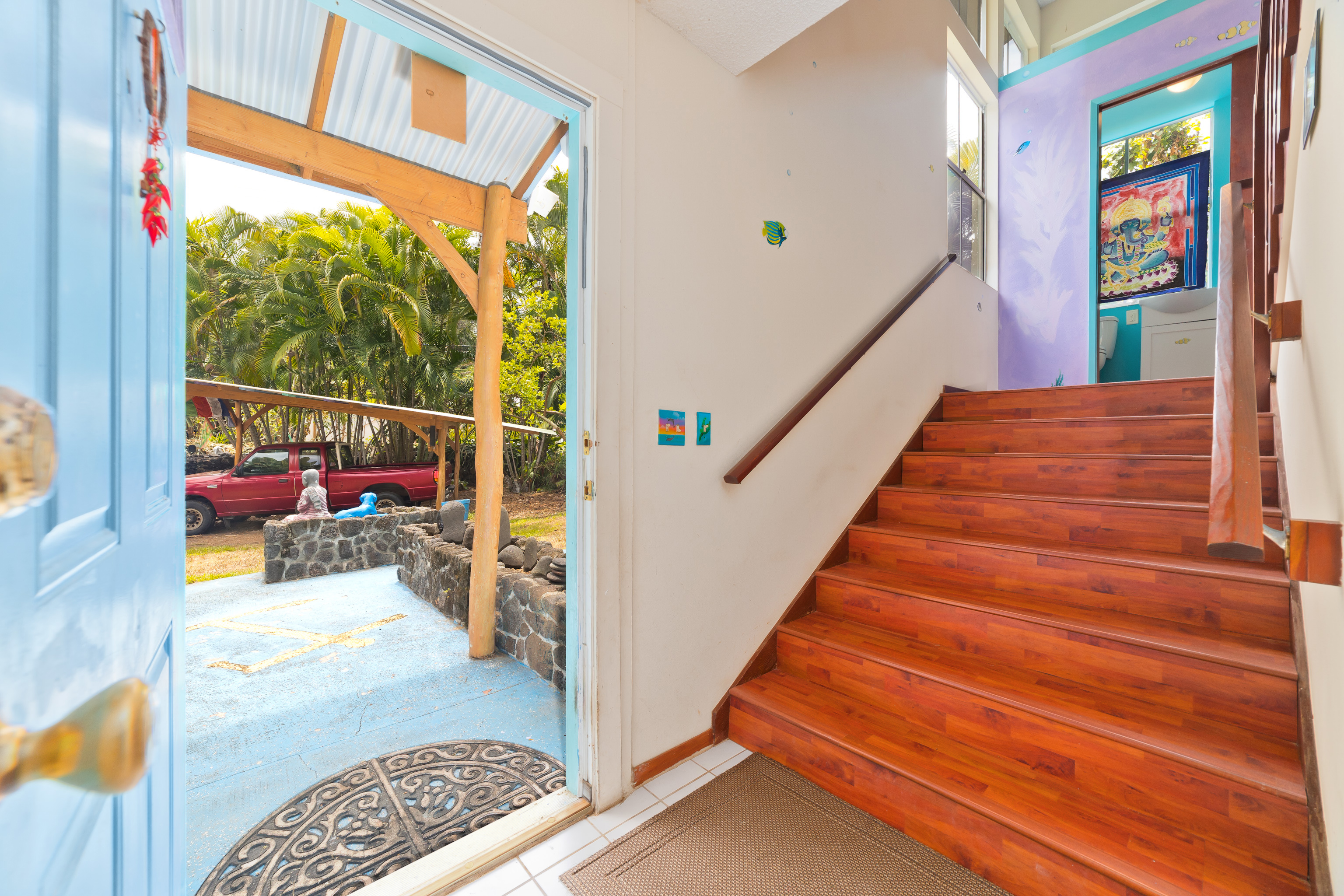 82-6301 Puuhonua Road Captain Cook, HI 96704 - Photo 5 of 27 a view of entryway bedroom and hall with wooden floor