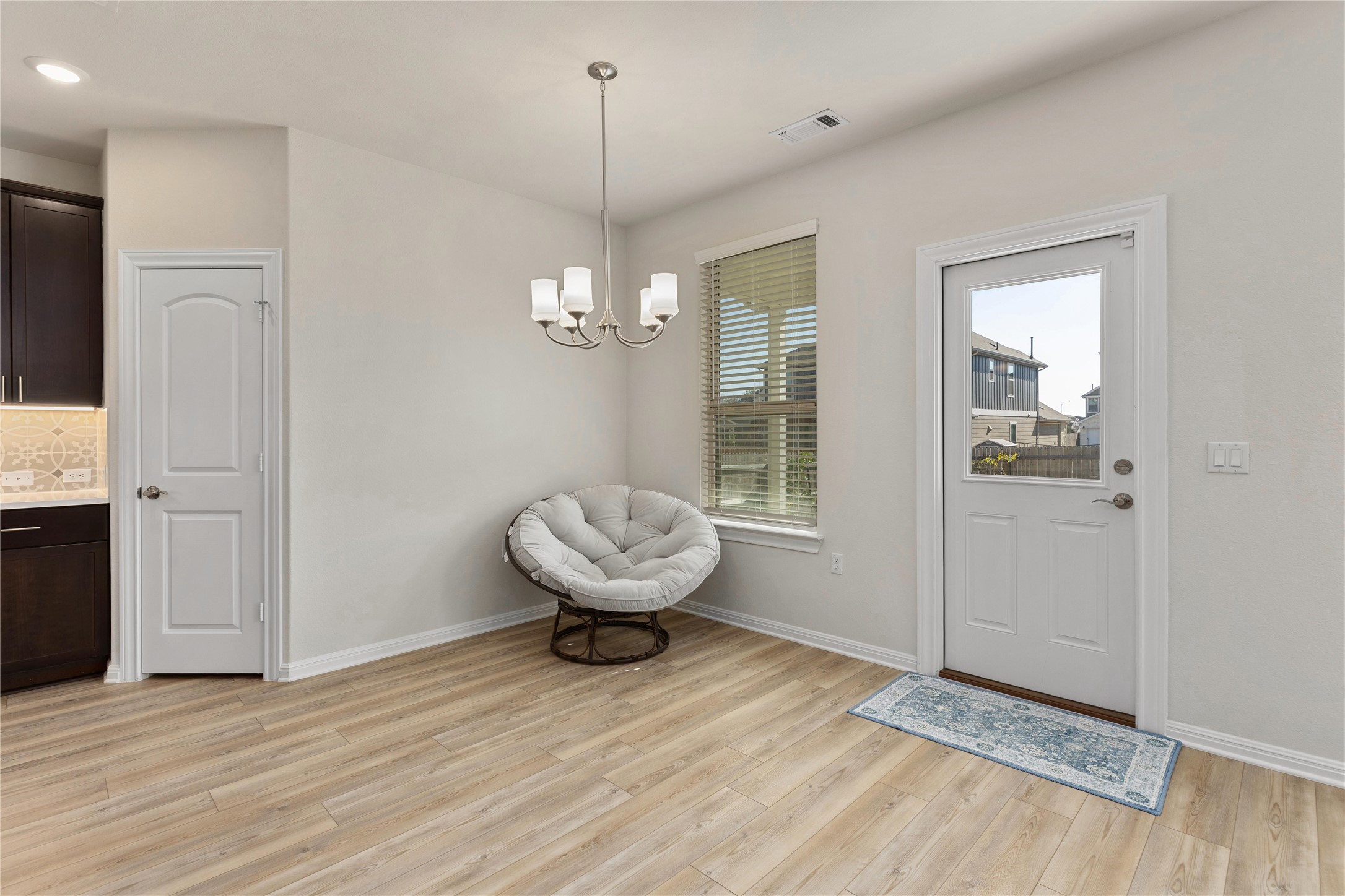 5513 Durango Pass Austin, TX 78724 - Photo 12 of 31 a view of an empty room with wooden floor and a window
