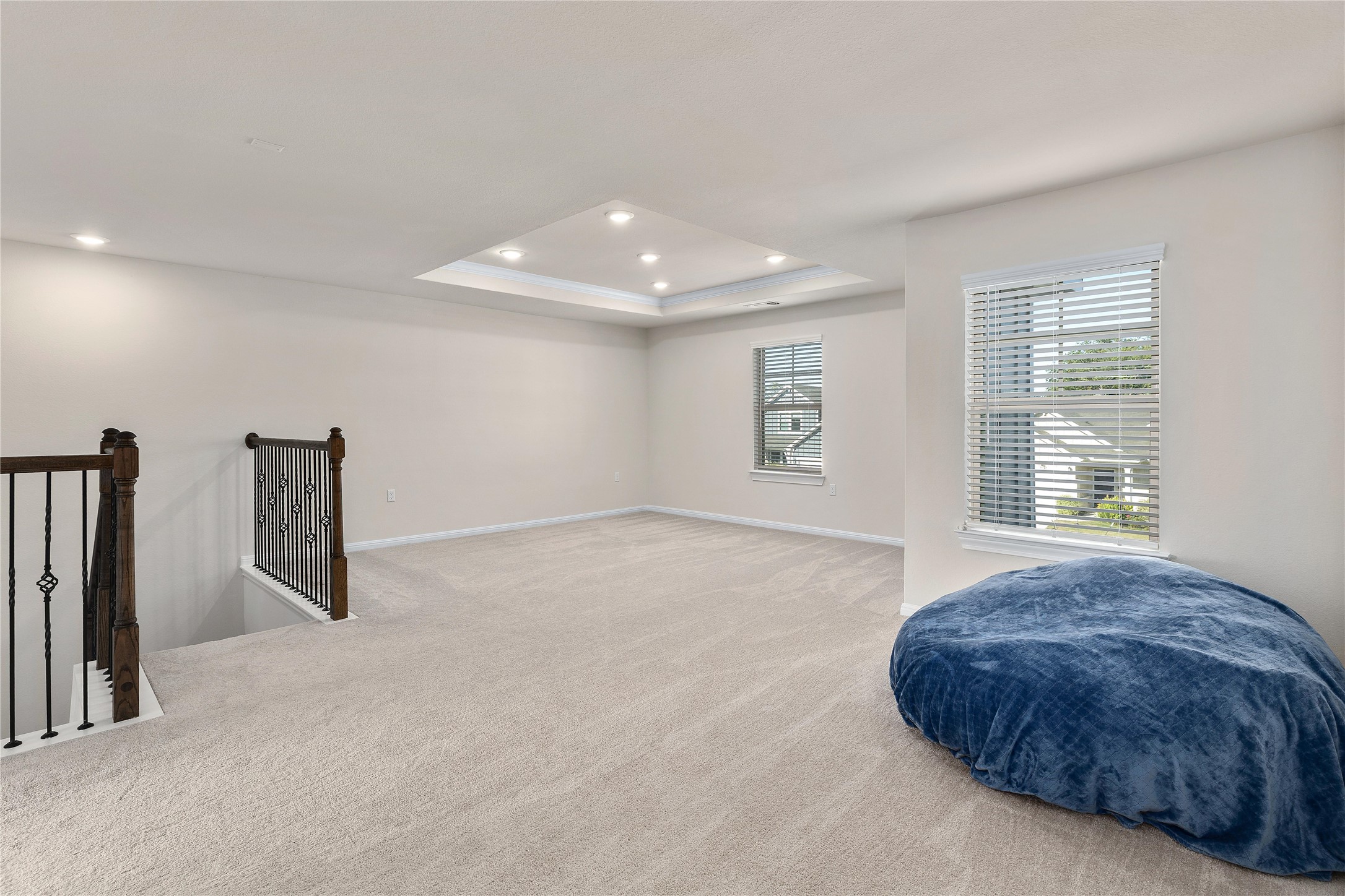 5513 Durango Pass Austin, TX 78724 - Photo 16 of 31 a spacious bedroom with a large bed and a large window