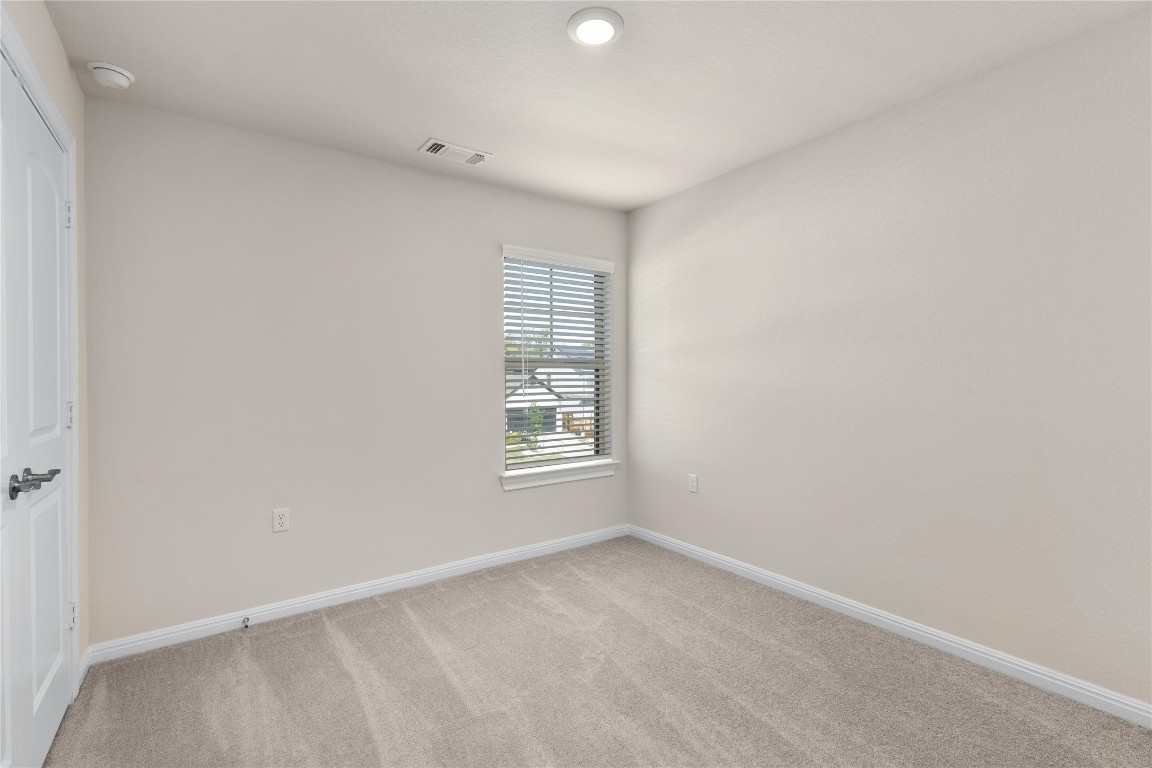 5513 Durango Pass Austin, TX 78724 - Photo 23 of 31 an empty room with windows
