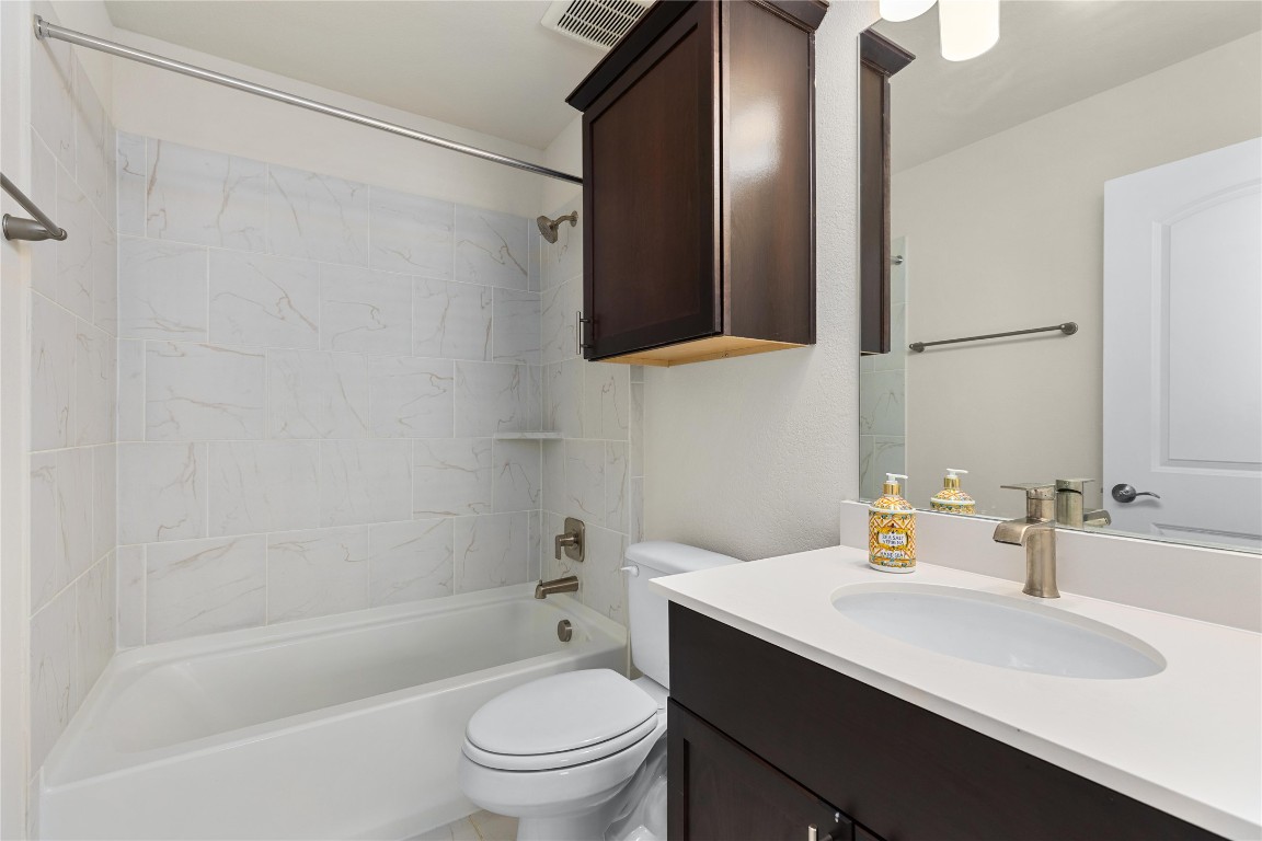 5513 Durango Pass Austin, TX 78724 - Photo 25 of 31 a bathroom with a sink toilet tub and shower