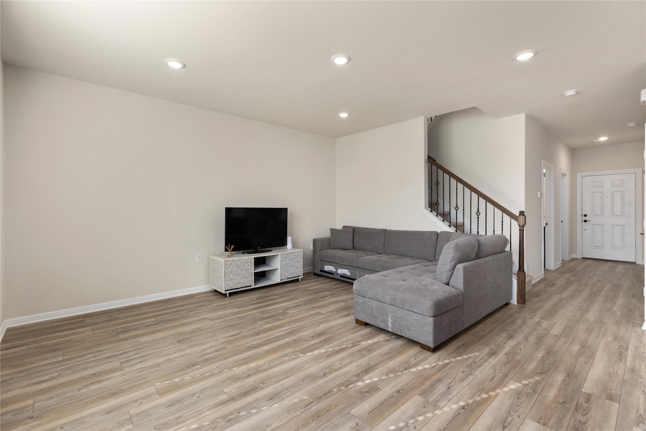 5513 Durango Pass Austin, TX 78724 - Photo 6 of 31 a living room with furniture and a flat screen tv