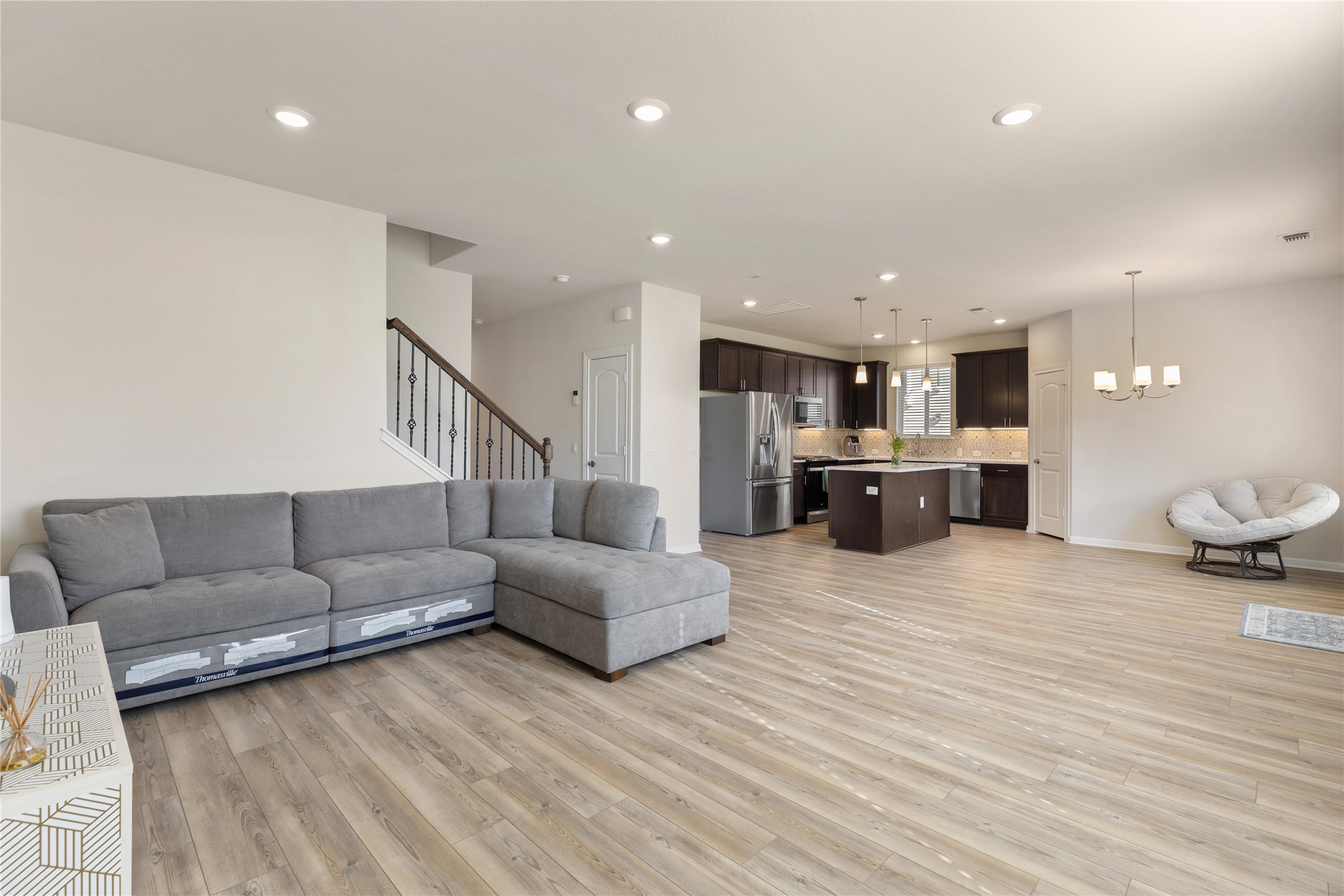 5513 Durango Pass Austin, TX 78724 - Photo 7 of 31 a living room with furniture and kitchen view