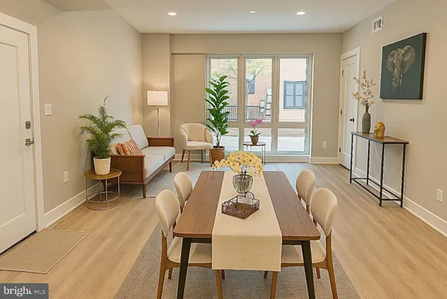 a view of a dining room with furniture window and outside view